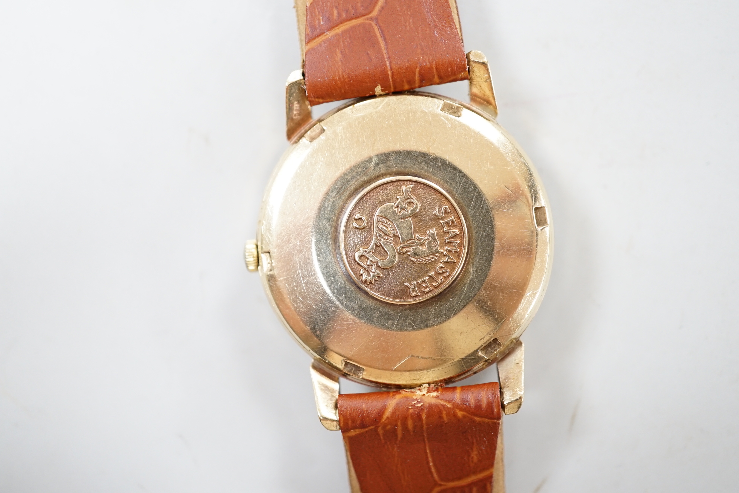 A gentleman's mid 1960's 9ct gold Omega Seamaster automatic wrist watch, movement c.552 on later associated strap, case diameter 35mm, with Omega box.